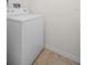 Laundry room with white washing machine and tile floor at 100 4Th S Ave # 132, St Petersburg, FL 33701