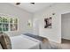 Inviting main bedroom with window and accent wall art above the bed at 100 4Th S Ave # 132, St Petersburg, FL 33701