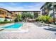 The pool is surrounded by lush landscaping, lounge chairs, and relaxing gazebos at 100 4Th S Ave # 132, St Petersburg, FL 33701