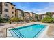 Relaxing community pool with a sunbathing deck surrounded by lush landscaping at 100 4Th S Ave # 132, St Petersburg, FL 33701
