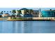Scenic waterfront vista showcasing modern structures and lush palm trees reflected in the calm water at 100 4Th S Ave # 132, St Petersburg, FL 33701