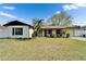 Charming single-story home featuring a well-maintained lawn and front-facing garage in a quaint neighborhood at 10717 Drummond Rd, Tampa, FL 33615