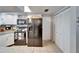Functional kitchen with stainless steel appliances, white cabinetry, and ample storage space at 10717 Drummond Rd, Tampa, FL 33615