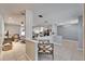 Bright open floor plan showcasing tile floors and a modern kitchen with a seamless flow to a cozy living area at 10717 Drummond Rd, Tampa, FL 33615