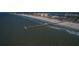 Aerial view showcasing a pier extending into the ocean at 11 San Marco St # 407, Clearwater Beach, FL 33767