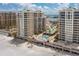 Breathtaking aerial view featuring condo buildings, lush landscaping, and beach access at 11 San Marco St # 407, Clearwater Beach, FL 33767