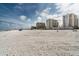 Expansive sandy beach with luxury condos in the background at 11 San Marco St # 407, Clearwater Beach, FL 33767