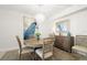 Cozy dining area featuring a round table, stylish chairs, and unique decor for a modern and inviting ambiance at 11 San Marco St # 407, Clearwater Beach, FL 33767