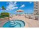 Inviting outdoor hot tub with ocean views and lounge area at 11 San Marco St # 407, Clearwater Beach, FL 33767