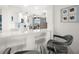 Modern condo kitchen with stainless steel appliances, granite counters and seating at the bar at 11 San Marco St # 407, Clearwater Beach, FL 33767