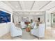 Bright living room features cozy seating, an aquarium and designer finishes at 11 San Marco St # 407, Clearwater Beach, FL 33767