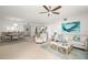 Spacious living room open to dining area features tile floors, modern furniture, and lots of natural light at 11 San Marco St # 407, Clearwater Beach, FL 33767