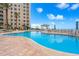 Beautiful outdoor pool with sun loungers and ocean view at 11 San Marco St # 407, Clearwater Beach, FL 33767