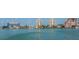 Beautiful waterfront view showcasing various buildings and docks along the shoreline at 11 San Marco St # 407, Clearwater Beach, FL 33767