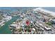 Discover this vibrant coastal community with serene waterways and charming residences, all captured in this stunning aerial view at 126 119Th Ave, Treasure Island, FL 33706