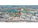 Discover this vibrant coastal community with serene waterways and charming residences, all captured in this stunning aerial view at 126 119Th Ave, Treasure Island, FL 33706