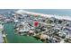 Aerial view showcases the home near the water and close to the beach at 126 119Th Ave, Treasure Island, FL 33706