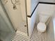 Updated bathroom featuring a white toilet and shower with classic black and white tile flooring at 126 119Th Ave, Treasure Island, FL 33706