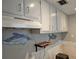Kitchen area featuring white cabinetry and wall art at 126 119Th Ave, Treasure Island, FL 33706