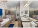 Spacious bathroom with double vanity, soaking tub, walk-in shower, and neutral tile at 13302 Trailing Moss Dr, Dade City, FL 33525