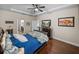 This bedroom has plenty of space and storage with hardwood floors and natural light at 13302 Trailing Moss Dr, Dade City, FL 33525