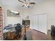 This bedroom is ready for you and features hardwood floors and a ceiling fan at 13302 Trailing Moss Dr, Dade City, FL 33525
