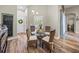 Cozy dining area with modern table setting and natural light coming through window with shutters at 13302 Trailing Moss Dr, Dade City, FL 33525