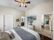 Serene main bedroom with ensuite bathroom, soft lighting, and neutral color palette at 13302 Trailing Moss Dr, Dade City, FL 33525