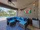 This patio offers comfortable seating and an outdoor living space at 13302 Trailing Moss Dr, Dade City, FL 33525