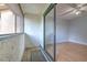 Balcony with tile floor and view into bedroom at 1424 Highland Ridge Cir, Brandon, FL 33510