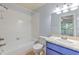 Close up of bathroom with vanity, mirror, toilet and tub with tile surround at 1424 Highland Ridge Cir, Brandon, FL 33510