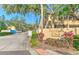 Carlisle Club townhome community signage, landscaping and roadway view at 1424 Highland Ridge Cir, Brandon, FL 33510