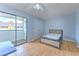 Bedroom featuring ceiling fan, wood floors, closet, and sliding glass doors to balcony at 1424 Highland Ridge Cir, Brandon, FL 33510