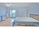 Bedroom featuring ceiling fan, closet, and sliding glass doors to balcony at 1424 Highland Ridge Cir, Brandon, FL 33510