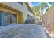 Enclosed patio space featuring paving, a sliding glass door and exterior storage at 1424 Highland Ridge Cir, Brandon, FL 33510