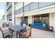 Large balcony with stylish seating and dining area, perfect for outdoor relaxation with ocean views at 1460 Gulf Blvd # 108, Clearwater, FL 33767