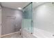 Modern bathroom featuring a glass shower enclosure and white subway tile providing a clean, contemporary design at 1460 Gulf Blvd # 108, Clearwater, FL 33767