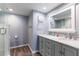 Stylish bathroom with double vanity, marble countertop, and glass-enclosed shower showcases a modern design at 1460 Gulf Blvd # 108, Clearwater, FL 33767