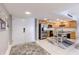 Stylish entryway leading to kitchen with stainless steel appliances and island at 1460 Gulf Blvd # 108, Clearwater, FL 33767