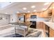 Bright kitchen with stainless steel appliances and center island at 1460 Gulf Blvd # 108, Clearwater, FL 33767