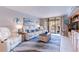 Open living room featuring plush seating and balcony views at 1460 Gulf Blvd # 108, Clearwater, FL 33767