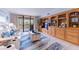 Cozy living room with built-in shelves and outside balcony at 1460 Gulf Blvd # 108, Clearwater, FL 33767
