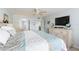Comfortable main bedroom with walk-in closet and TV at 1460 Gulf Blvd # 108, Clearwater, FL 33767