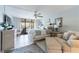 Serene main bedroom featuring a ceiling fan and balcony at 1460 Gulf Blvd # 108, Clearwater, FL 33767