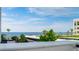 Beautiful ocean view from condo balcony with palm trees in view at 1460 Gulf Blvd # 108, Clearwater, FL 33767