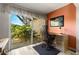 Office space with outdoor access featuring sliding glass doors and an outdoor seating area at 1701 Pinehurst Rd # 31D, Dunedin, FL 34698