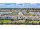 Aerial view of a community with well manicured lawns and sidewalks at 18023 Canopy Pl, Bradenton, FL 34211