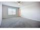 Bedroom with carpeting, large window and bright interior at 18023 Canopy Pl, Bradenton, FL 34211