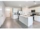 Well-lit open kitchen with stainless appliances and tile flooring at 18023 Canopy Pl, Bradenton, FL 34211