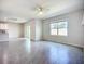 Open-concept living room features tile flooring and natural light at 18023 Canopy Pl, Bradenton, FL 34211